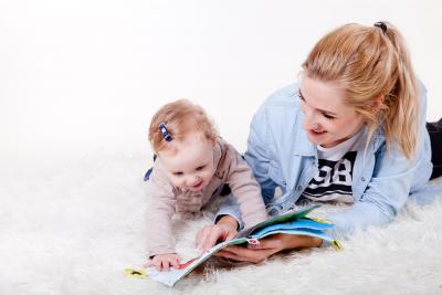 Mother reading book to baby