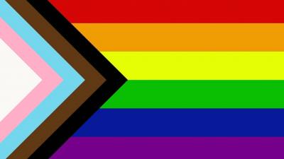 Image of pride flag 2020 featuring rainbow, blue, white, pink, black and brown stripes