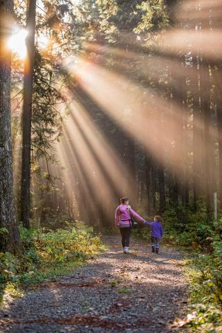 woman and child hiking in woods